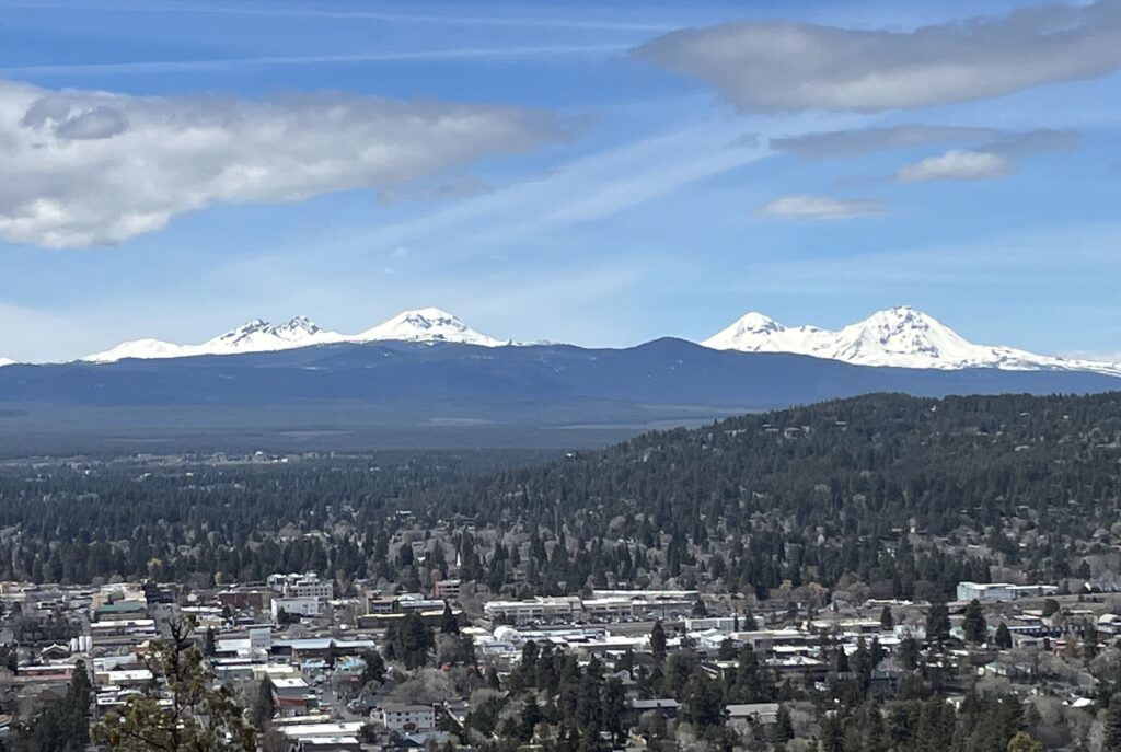 View of Bend, Oregon from Pilot Butte with the snow-covered Three Sisters mountains in the Cascade Range.
